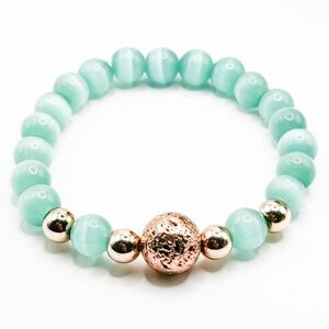 NWOT Genuine green cat eye stretch bracelet with rose gold lava rock 6”